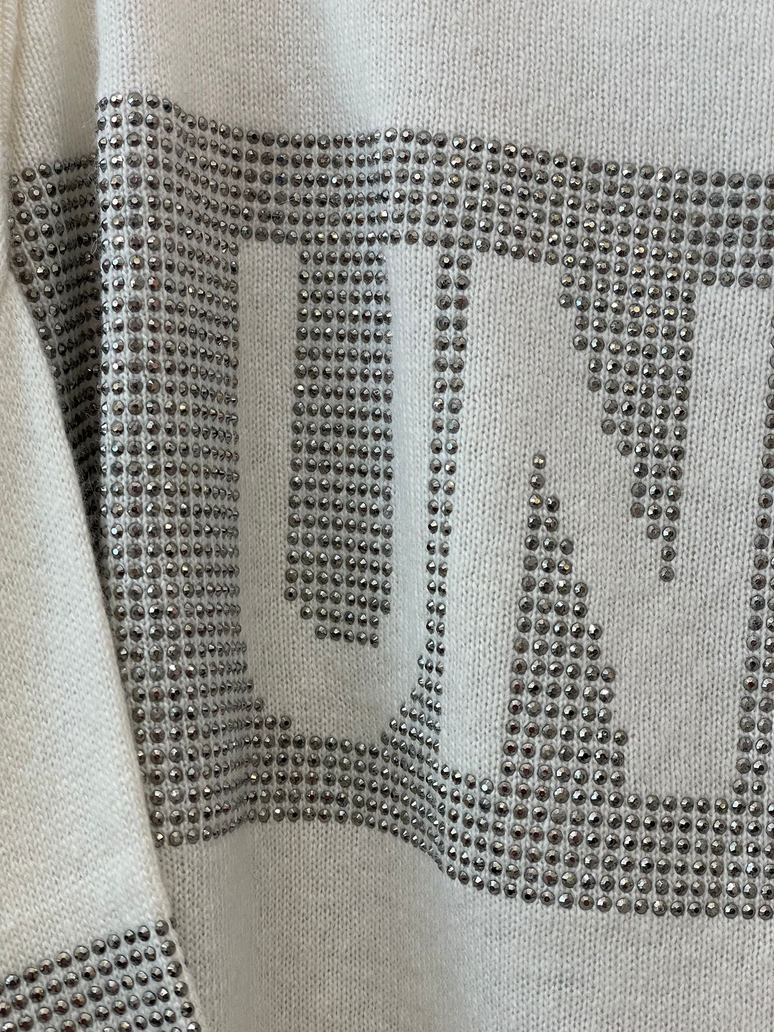 Maglia unique bianca con dettagli brillantinati